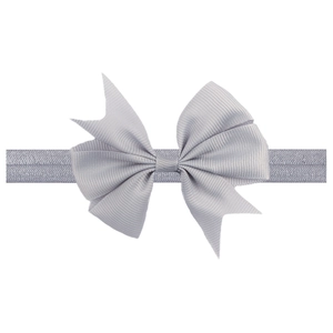 Detailed macro view of the light grey grosgrain ribbon bow and elastic headband texture