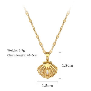Detail of shell pendant necklace with micro-pave zircons and center pearl in gold plating