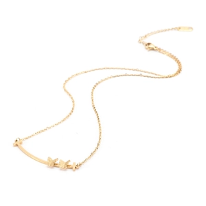 Gold-plated stainless steel smile necklace with double butterfly accents on a white background