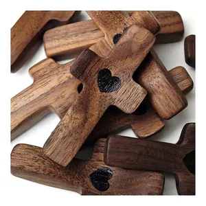 Handcrafted walnut wood thumb cross with heart carving for prayer and comfort