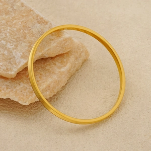 Minimalist gold plated titanium steel bangle with fine horizontal striped texture design