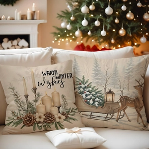 Detail of Christmas pillow cases with deer and candle print on linen fabric