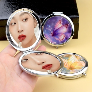 Portable metal butterfly compact mirrors in silver frame with dual-sided folding design