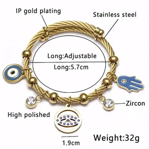 Bracelet câble en acier inoxydable doré avec main de Fatima et charms œil maléfique