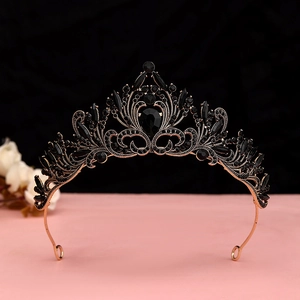 Close-up of vintage Baroque black crystal crown with rose gold metal and pear-shaped stones