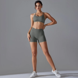 Macro detail of seamless knit ribbed texture on grey-green yoga sports bra and shorts set