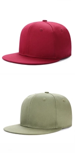 Close-up of premium twill cotton texture and stitching on burgundy and olive snapback caps