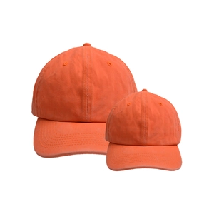 Detail of neon orange washed cotton baseball caps with stitching and air vents