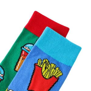Detailed macro view of cotton socks featuring pixelated French fries and drink embroidery