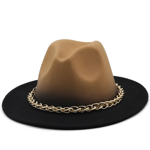 Detail of wool fedora hat with camel to black gradient and gold chain decoration