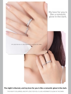 Detailed close-up of 925 silver couples rings with star engraving and cubic zirconia stones