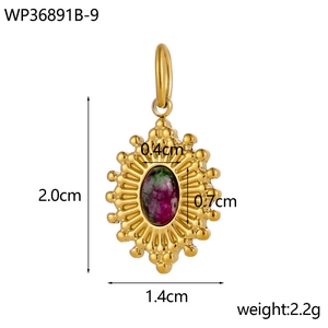Detail view of oval sunburst gold pendant with inlaid turquoise stone and size dimensions