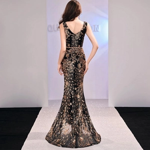 Elegant black mermaid evening dress with gold sequins and a deep V-neck backless design