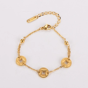 Macro detail of 18K gold-plated bracelet with hollow coin charms and 18KRGP engraving