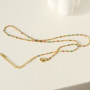 Minimalist gold titanium chain necklace with multi-colored enamel beads and lobster clasp