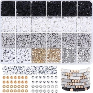 Macro view of DIY jewelry kit with black, white, and grey clay beads and letter beads