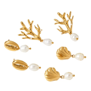 Three pairs of gold ocean-themed stud earrings featuring coral, shells, and white pearls