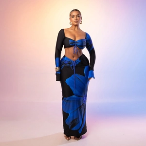 Detail of floral drawstring crop top and matching maxi skirt set in professional lighting
