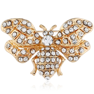 Macro shot of gold-tone bee brooch with sparkling rhinestones and crystal accents