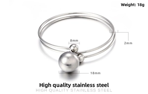 Detail of stainless steel double ring bracelet with 18mm bead and 8mm small spheres