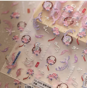 Detailed 5D embossed nail stickers featuring phoenix and floral motifs in soft pink