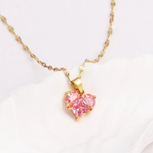 Titanium steel necklace featuring a luxury pink heart-shaped zircon pendant and gold chain