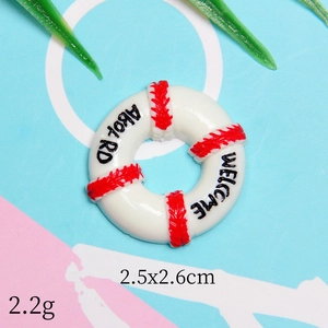 Miniature resin lifebuoy charm in red and white with Welcome Aboard text 2.5x2.6cm