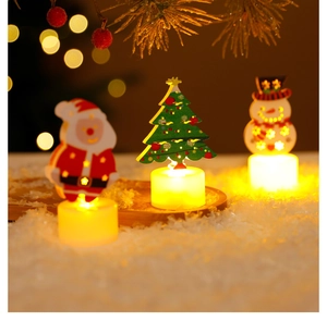 Three wooden LED Christmas candle lights featuring Santa, Snowman, and Tree on faux snow