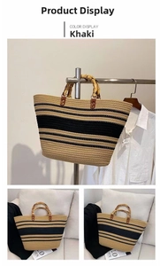 Detail of woven tote bag featuring striped texture and natural bamboo top handles