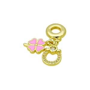 Detail of pink enamel four-leaf clover and gold horseshoe pendant with white zircon