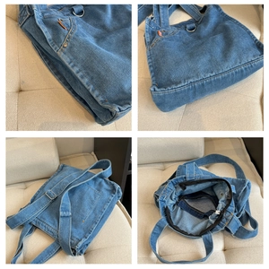Detail view showing denim fabric texture, metal adjustment buckle and inner lining