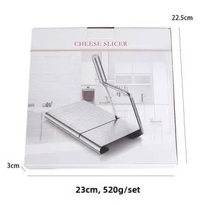 Cheese slicer packaging showing dimensions of 23x22.5x3cm and weight of 520g per set