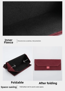 Macro view of burgundy foldable plush eyewear case showing soft black protective lining
