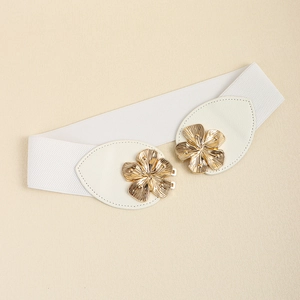 Detail of white elastic waist belt with gold flower buckle and leaf-shaped PU leather patches