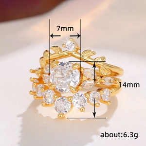 Golden minimalist stackable ring set with clear cubic zirconia and leaf patterns