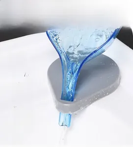 V-shaped leaf soap holder with self-draining system on white ceramic sink