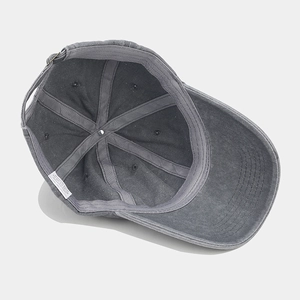 Inside view of vintage dark grey washed cotton baseball cap showing internal structure
