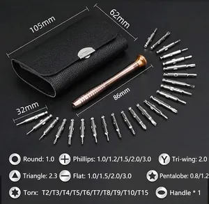 Macro view of 24 precision screwdriver bits with gold alloy handle in a leather case
