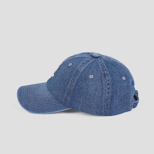 Detail view of navy denim baseball cap with letter R embroidery and adjustable strap