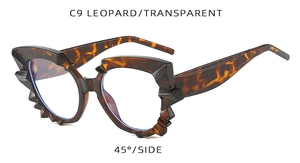 Detailed side view of irregular leopard print glasses frames with geometric jagged edges