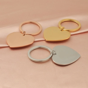 Polished mirror stainless steel heart keychains in rose gold, gold, and silver finishes