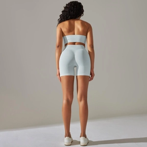 Close-up back view of ribbed seamless yoga set including sports bra and shorts in light blue