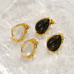 French style teardrop resin stud earrings in black and clear colors with gold accents