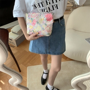 Floral cotton makeup bag featuring elegant pearl strap and soft pastoral aesthetics
