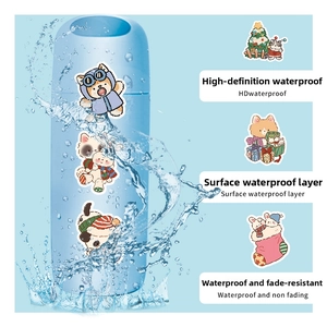 Waterproof Christmas stickers with gingerbread and fox motifs on a blue water flask