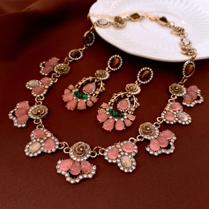 Vintage bronze jewelry set with pink translucent gemstones and crystal accents