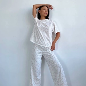 Women's pajama set featuring pink floral print short sleeve top and long pants