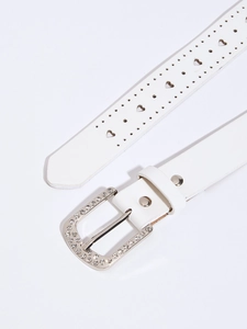 Close-up of white leather belt featuring heart-shaped cutouts and rhinestone silver buckle