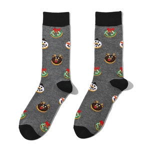 Close-up of festive gray crew socks featuring colorful Christmas wreath and snowman patterns