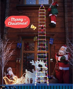 Macro detail of LED ladder lights featuring a climbing Santa Claus on a wooden wall